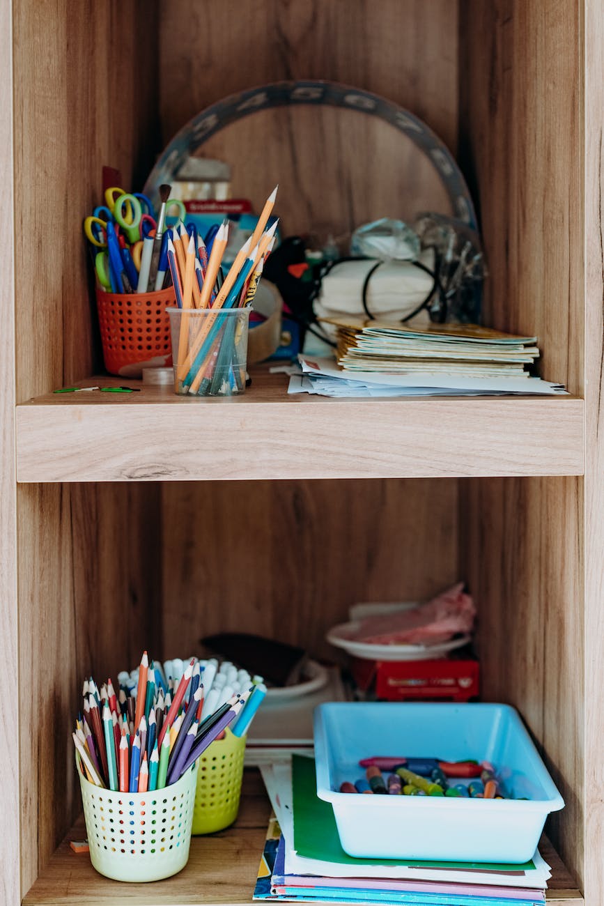 craft supplies in the wooden shelves